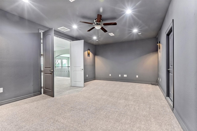 unfurnished room featuring visible vents, baseboards, recessed lighting, ceiling fan, and carpet flooring