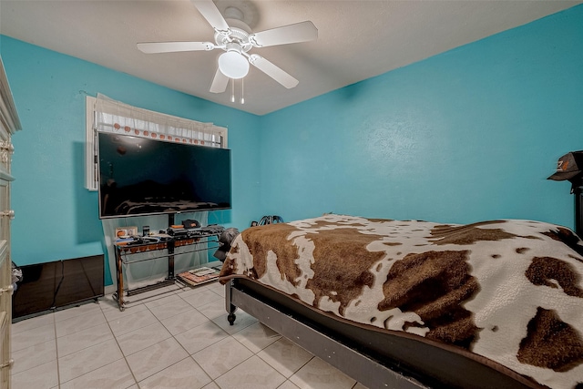 bedroom with ceiling fan and light tile patterned floors