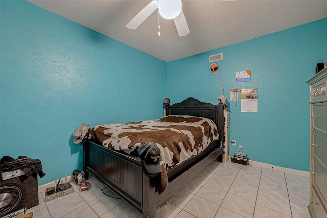 tiled bedroom with ceiling fan