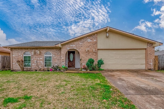 ranch-style house featuring a garage and a front lawn