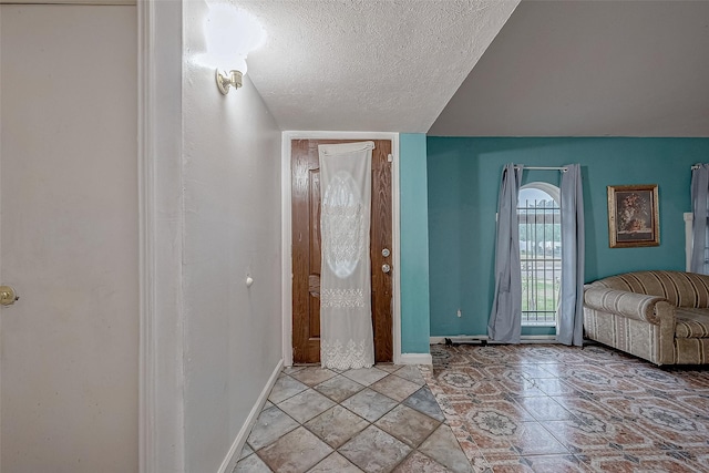 entryway featuring a textured ceiling