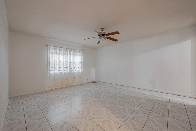 spare room with ceiling fan