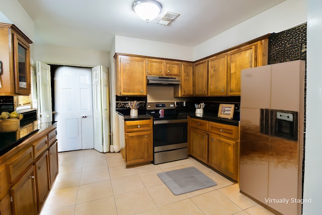 kitchen with stainless steel appliances and light tile patterned floors