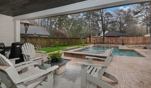 view of pool featuring a patio and an in ground hot tub