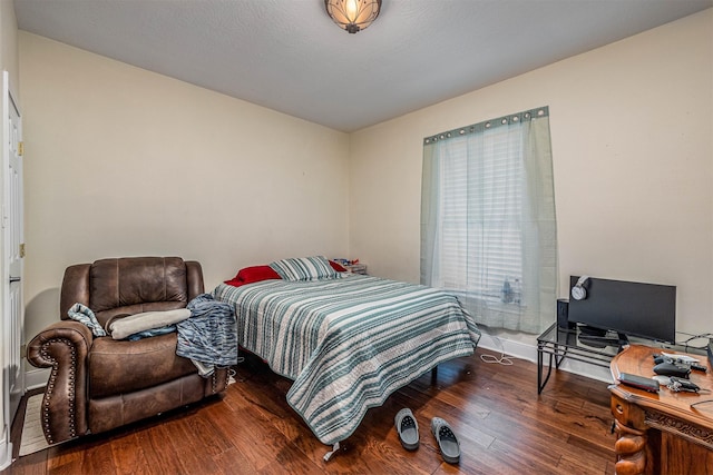 bedroom featuring hardwood / wood-style floors