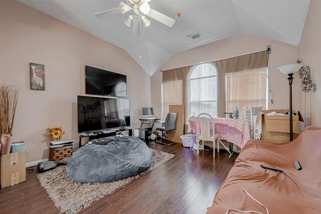 bedroom with vaulted ceiling, dark hardwood / wood-style floors, and ceiling fan