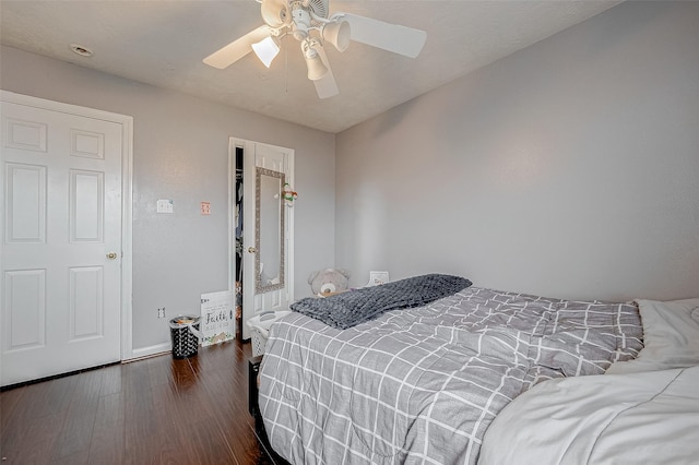 bedroom with dark wood-type flooring and ceiling fan