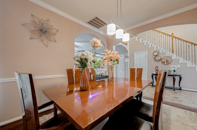 dining area with ornamental molding