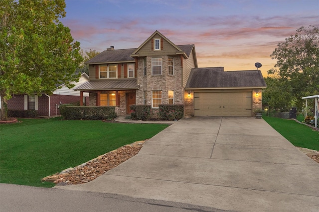 craftsman-style home with a garage and a lawn