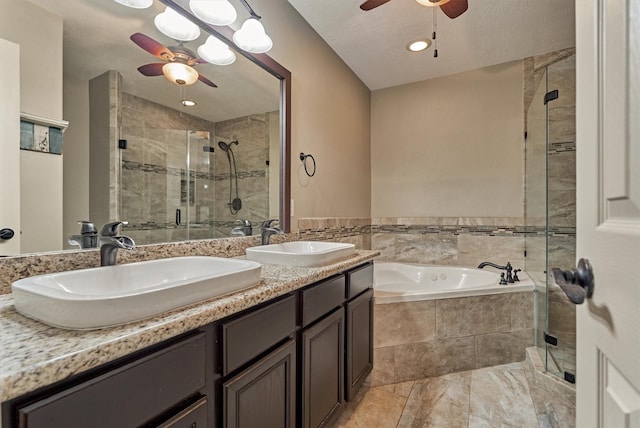 bathroom with ceiling fan, vanity, independent shower and bath, and lofted ceiling