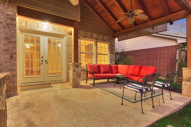 patio terrace at dusk featuring french doors, ceiling fan, an outdoor hangout area, and a gazebo