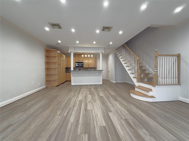 unfurnished living room featuring light wood-type flooring