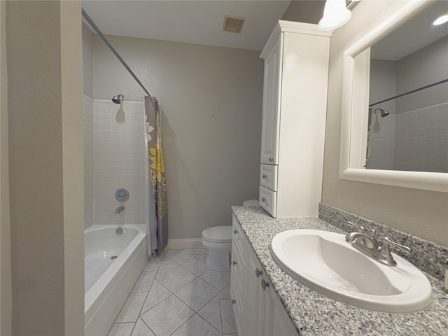 full bathroom featuring tile patterned floors, vanity, toilet, and shower / bath combo with shower curtain