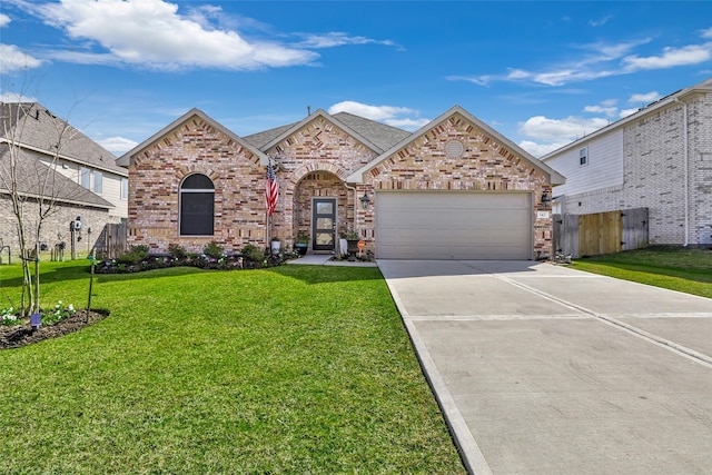 view of front of house with a garage and a front yard