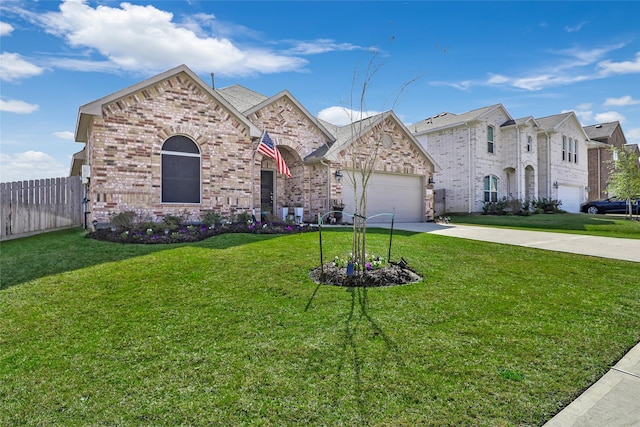 view of front of property with a garage and a front yard