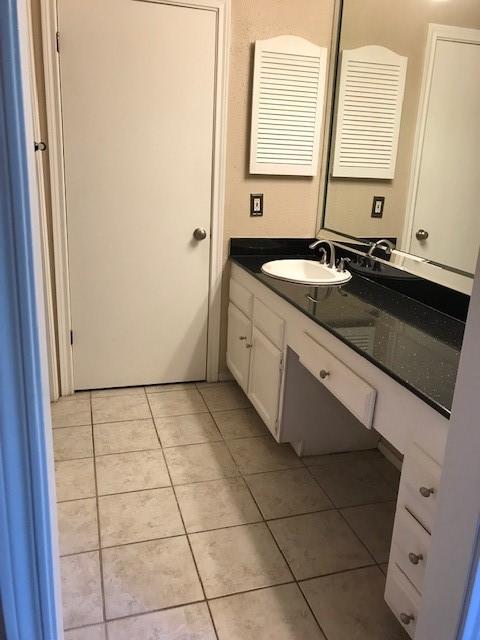 bathroom with vanity and tile patterned floors