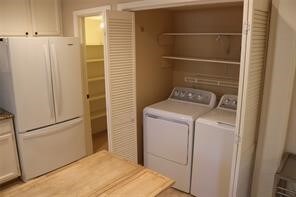 laundry area with washing machine and dryer