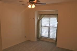 spare room featuring ceiling fan