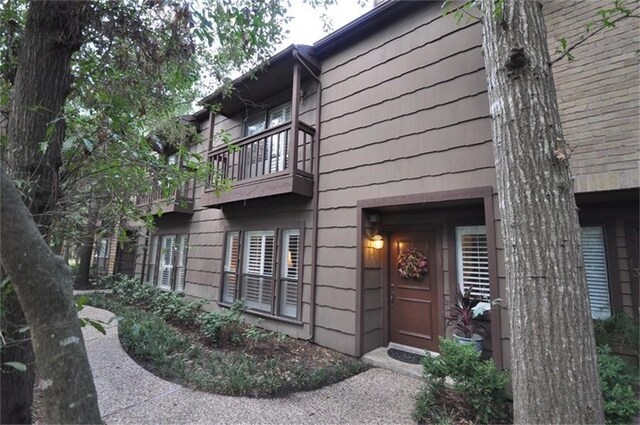 doorway to property with a balcony