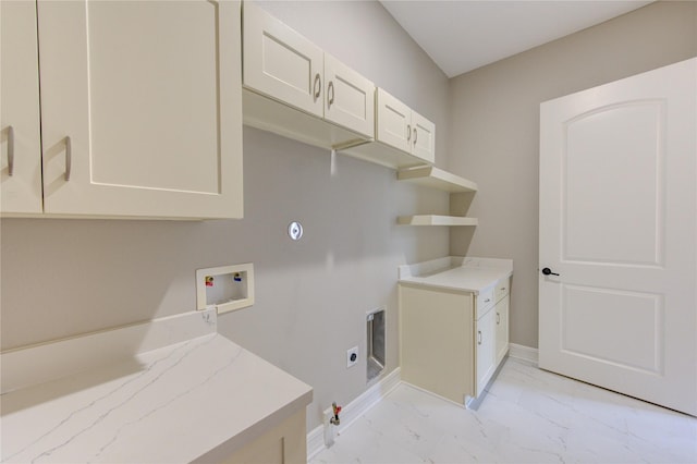 clothes washing area with cabinets, gas dryer hookup, electric dryer hookup, and hookup for a washing machine