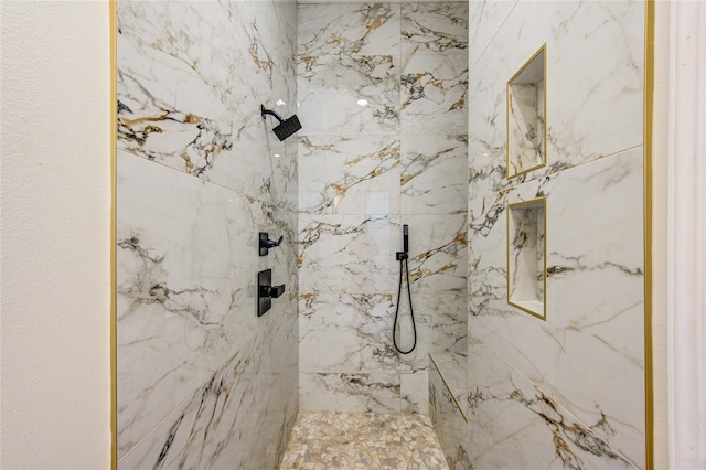 bathroom featuring a tile shower