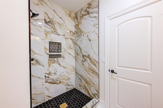 bathroom with tiled shower