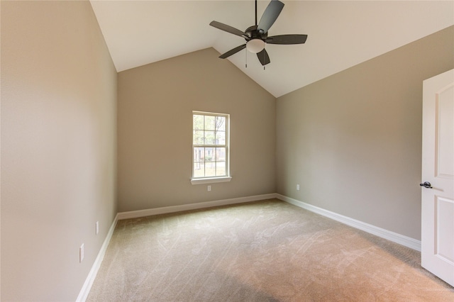 unfurnished room with lofted ceiling, light colored carpet, and ceiling fan