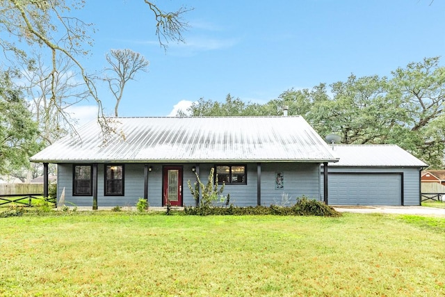 view of front of house featuring a garage and a front yard