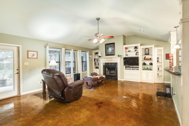 living room with ceiling fan, lofted ceiling, and concrete floors