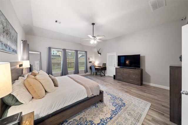 bedroom with light hardwood / wood-style floors and ceiling fan