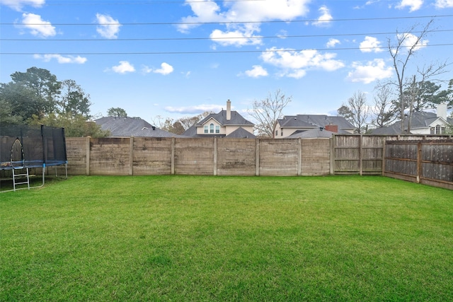 view of yard featuring a trampoline