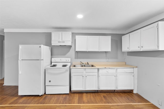 kitchen featuring white cabinetry, white appliances, sink, and hardwood / wood-style floors