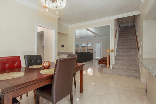 dining area with an inviting chandelier and ornamental molding