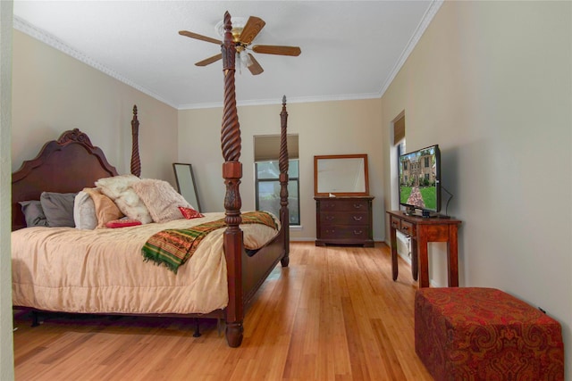 bedroom featuring crown molding, light hardwood / wood-style flooring, and ceiling fan