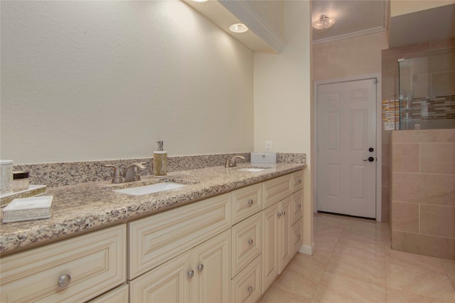 bathroom with a shower with door, vanity, and crown molding