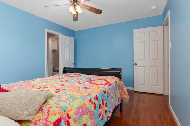 bedroom featuring dark wood-type flooring and ceiling fan