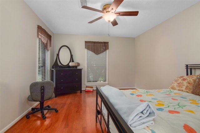 bedroom featuring hardwood / wood-style flooring and ceiling fan