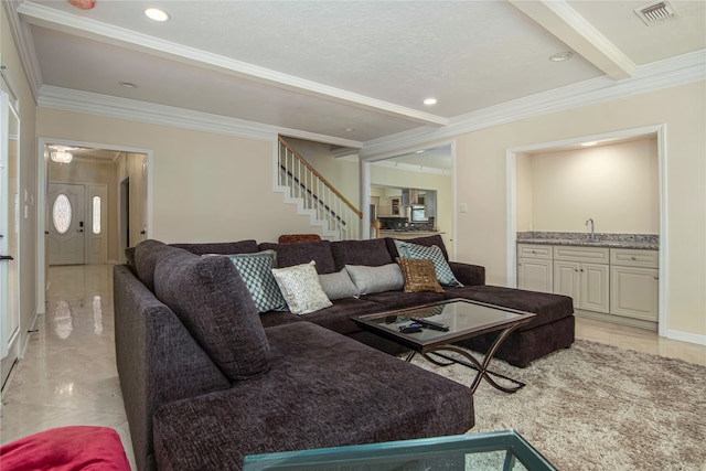 living room with ornamental molding, indoor wet bar, and beam ceiling