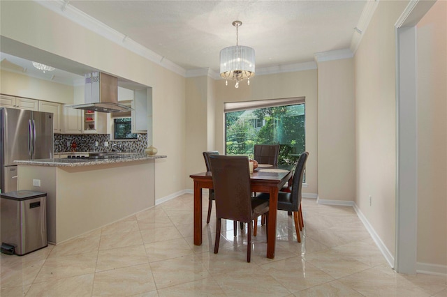 dining area with a notable chandelier and crown molding