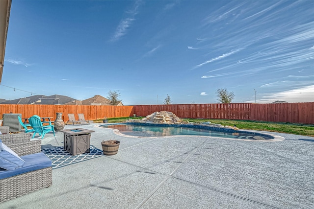 view of swimming pool featuring a patio area