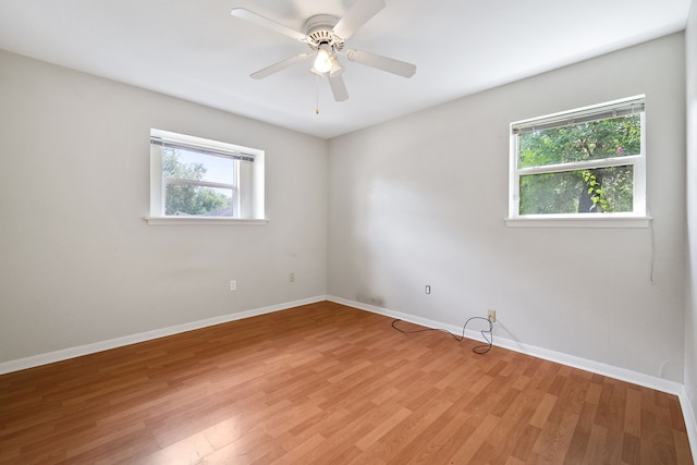 spare room with ceiling fan and light hardwood / wood-style floors