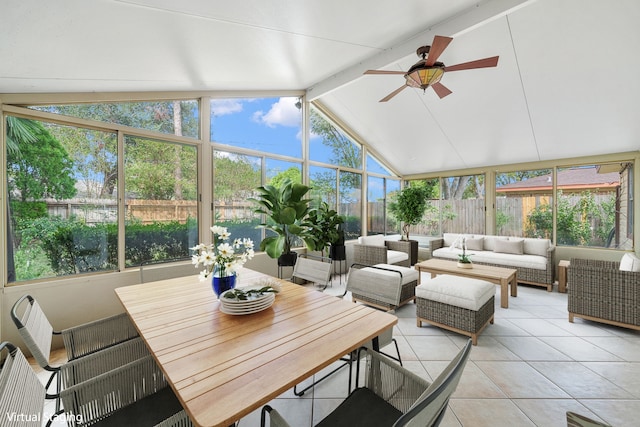 sunroom featuring vaulted ceiling with beams and ceiling fan