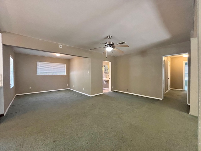 carpeted empty room with ceiling fan