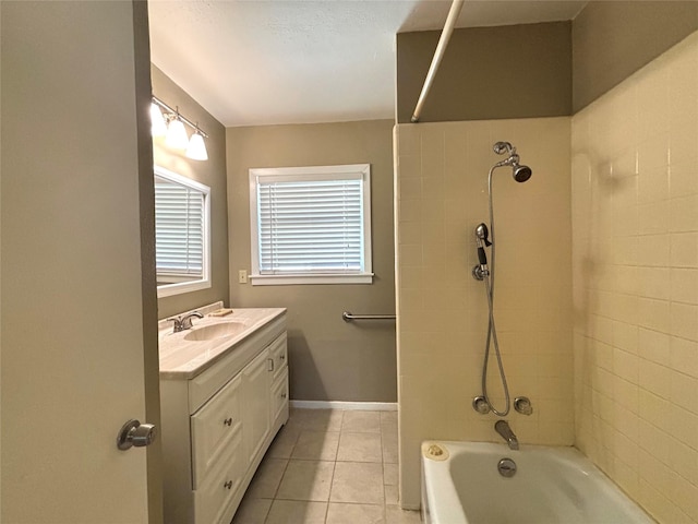 bathroom featuring vanity, tiled shower / bath combo, and tile patterned floors