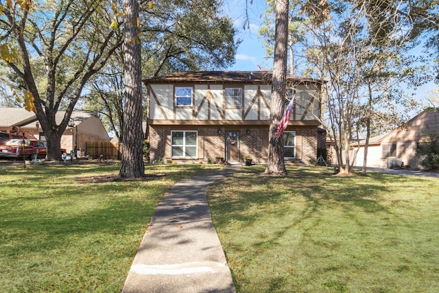 tudor house featuring a front yard