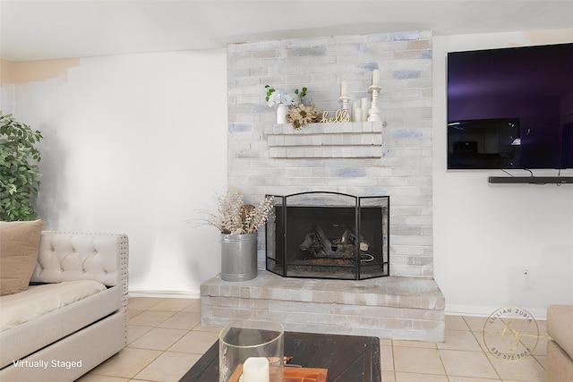 tiled living room featuring a brick fireplace