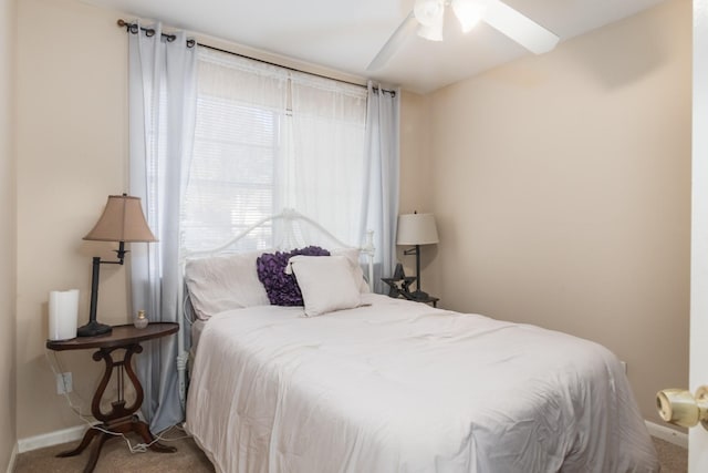 bedroom with ceiling fan and carpet flooring