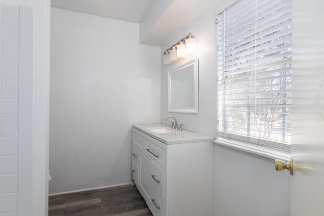 bathroom with hardwood / wood-style flooring and vanity