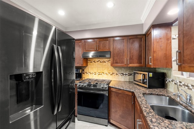 kitchen with sink, dark stone countertops, backsplash, ornamental molding, and stainless steel appliances