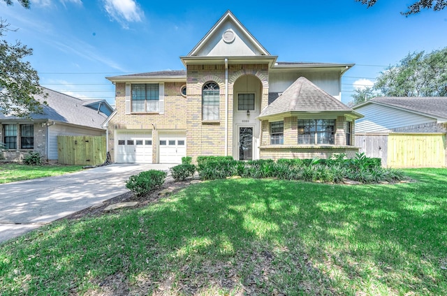 view of front of home featuring a garage and a front lawn